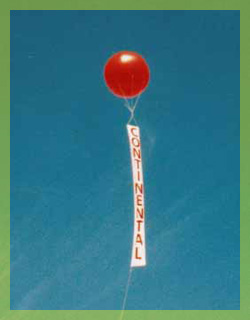 helium advertising balloon with 15ft. VERTICAL banner.